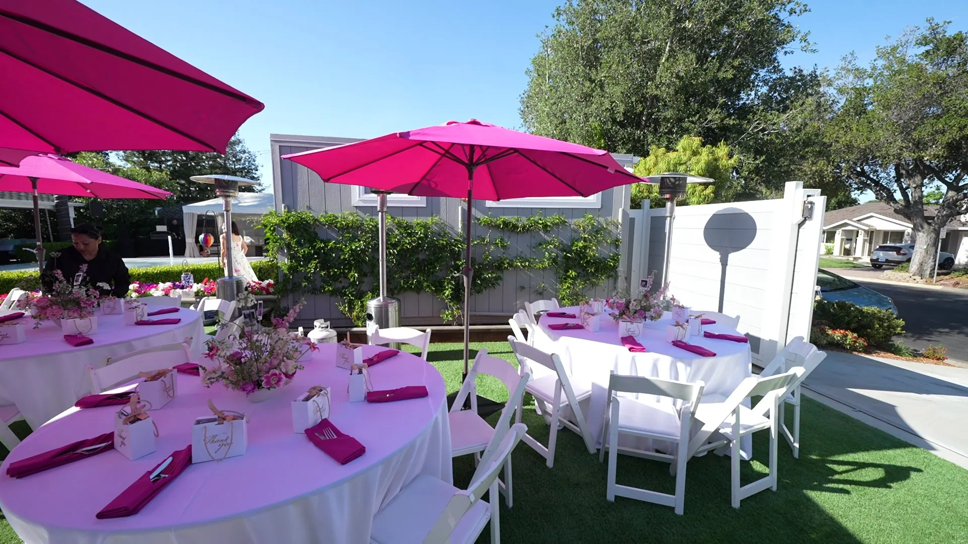 Lawn tables set with linens for a Portola Valley afternoon party