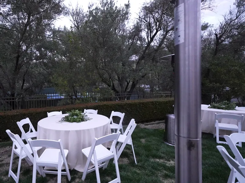 Garden table set with linens for a small gathering near Stanford