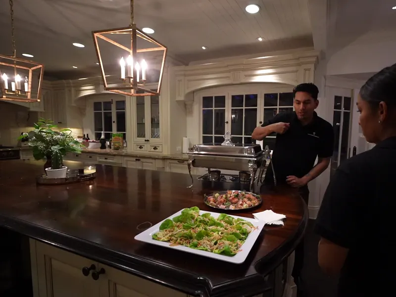 Chef plating a platter in the kitchen ahead of a Redwood City delivery