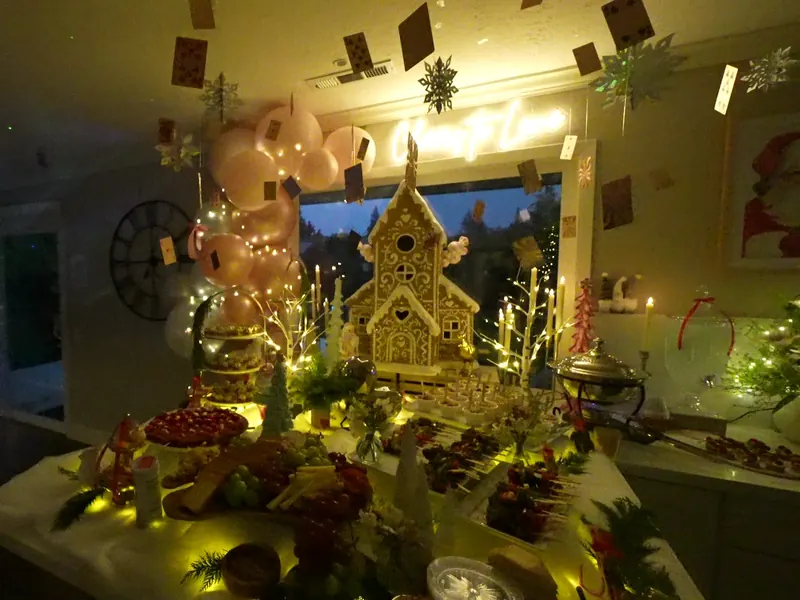 Warmly lit dessert table at an indoor Los Altos gathering