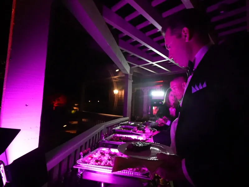Chafing line holding entrées warm at an evening Mountain View event