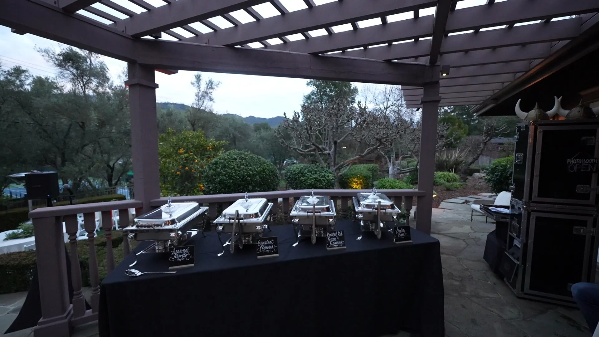 Buffet set under a pergola for an outdoor reception near Stanford