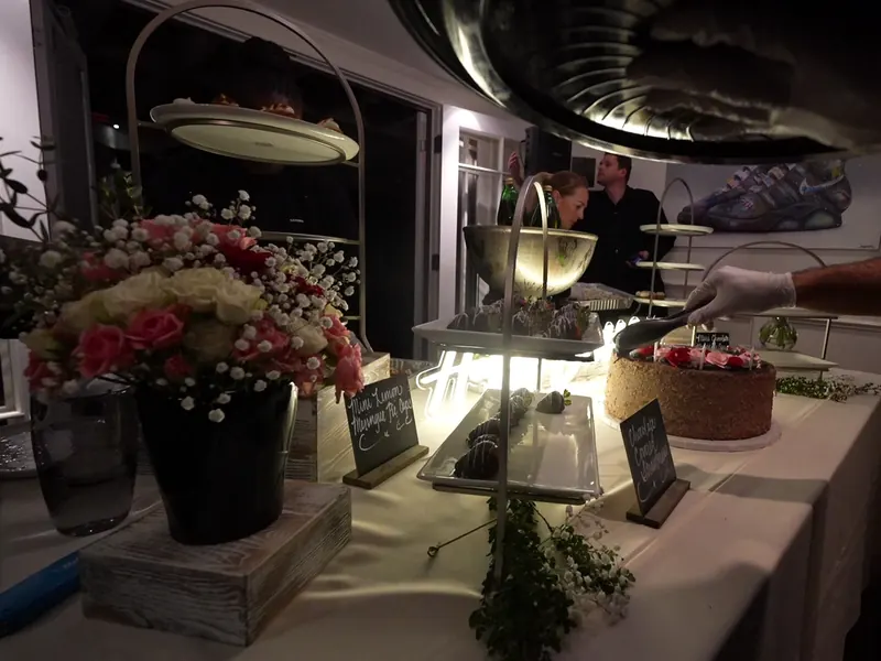 Floral-accented buffet station styled for a Palo Alto dinner party